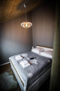 Posteľ alebo postele v izbe v ubytovaní Apartamenty przy skoczni