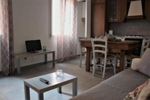 a living room with a couch and a table at Home in Ravenna