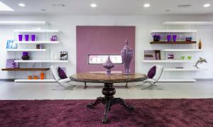 a room with a table with a vase on it at Yes Hotel Touring & SPA in Rimini