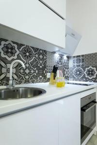 Kuchyň nebo kuchyňský kout v ubytování Studio apartman Summer Flower