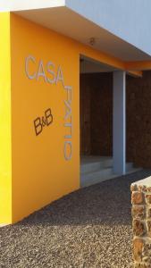 a yellow building with the words casa blanca on it at Casa Patio in Tarrafal