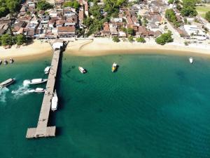 an aerial view of a dock with boats in the water at Pousada Agua Viva in Abraão