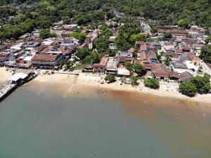 an aerial view of a beach with a group of houses at Pousada Agua Viva in Abraão