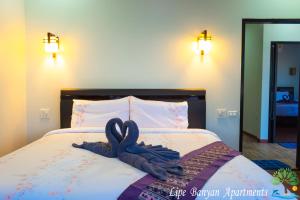 Lipe Banyan Apartments客房内的一张或多张床位