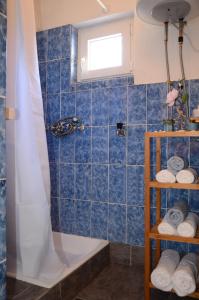 a bathroom with a tub and a shower at Holiday House Family Fun in Cesarica +23 photos