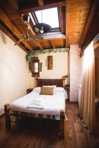 A bed or beds in a room at Orgullo Rural