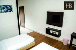 TV a/nebo společenská místnost v ubytování H Benjamin Residence