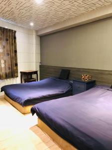 Llit o llits en una habitació de 橙橙民宿