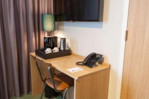TV a/nebo společenská místnost v ubytování Best Western Plus Hotel Amstelveen