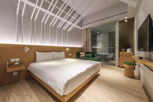 Katil atau katil-katil dalam bilik di HOTEL PIN Jiaoxi