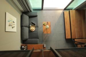 a room with a wall with a clock on the wall at Space59 Hotel in Ratchaburi