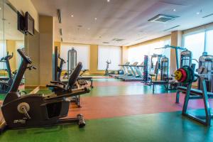 a gym with several treadmills and exercise bikes at Kahya Resort Aqua & Spa in Konaklı