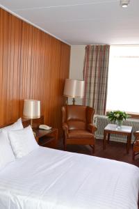 En eller flere senge i et værelse på Fletcher Hotel De Zalm