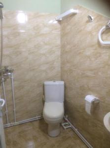 a bathroom with a toilet and a sink at SADA Guesthouse in Vardzia