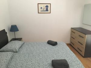 Łóżko lub łóżka w pokoju w obiekcie VILLA DEGLI ULIVI