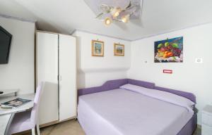 Posteľ alebo postele v izbe v ubytovaní Capri Dreaming
