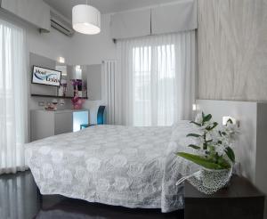 Postel nebo postele na pokoji v ubytování Hotel Letizia