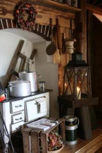 a kitchen with a stove and a stove top oven at Landgasthof am Bäumchen in Weißenfels