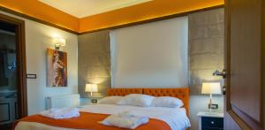 A bed or beds in a room at Abi Luxury Villas