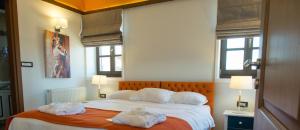 A bed or beds in a room at Abi Luxury Villas