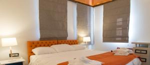 A bed or beds in a room at Abi Luxury Villas