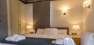 A bed or beds in a room at Abi Luxury Villas