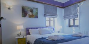 A bed or beds in a room at Abi Luxury Villas