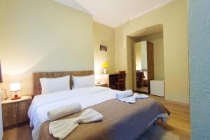 Postel nebo postele na pokoji v ubytování Hotel Tabi + 22 fotografií