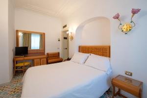 Кровать или кровати в номере Grand Hotel Flora