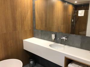 Koupelna v ubytování Hotel Olimp Business & Spa
