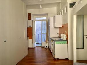 a kitchen with a sink and a stove at La GEMMA del Quadrilatero in Turin