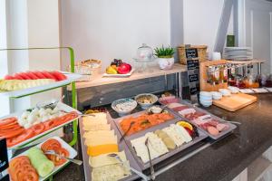 a buffet with lots of different types of food at GDA Hotel Schwiecheldthaus in Goslar