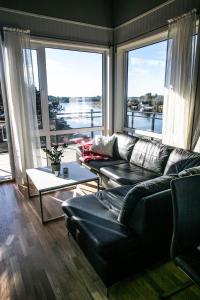 
a living room filled with furniture and a window at Kristiansand Feriesenter in Kristiansand
