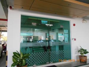 a glass door with a sign that reads the morgue at The Hug Condo Bangsaen in Bangsaen