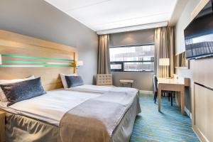 Кровать или кровати в номере Quality Hotel Fredrikstad