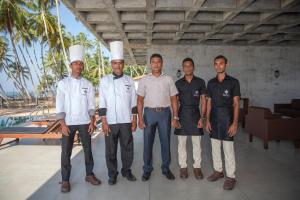 a group of men standing next to each other at Serendivi Resort Villa in Tangalle +56 photos
