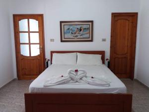 Postel nebo postele na pokoji v ubytování Sunset Guest house