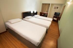 Postel nebo postele na pokoji v ubytování Hotel Moncloa