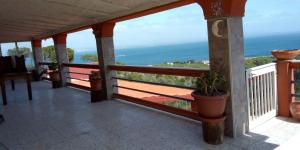 a balcony with a view of the ocean at Il Ginepro in Carloforte