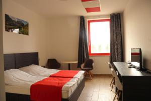 Postel nebo postele na pokoji v ubytování TOP HOTEL