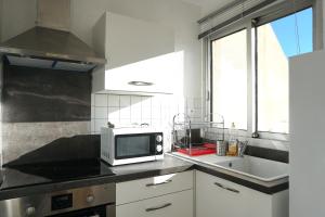 Kjøkken eller kjøkkenkrok på Studio terrasse Montpellier - Parking privé - Proche ligne 1