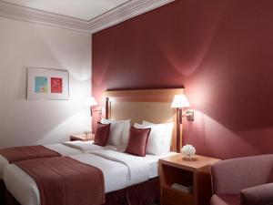 Posteľ alebo postele v izbe v ubytovaní Athens Zafolia Hotel