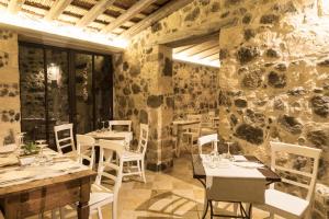 Reštaurácia alebo iné gastronomické zariadenie v ubytovaní Il Cortiletto Hotel Maison