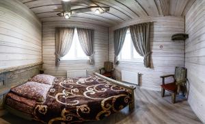 a bedroom with a bed in a room with a ceiling at Shuvalovskoye Podvorye in Saint Petersburg