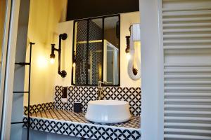 a bathroom with a sink and a mirror at B&B A Casa di Giulia in Castel di Sangro +50 photos