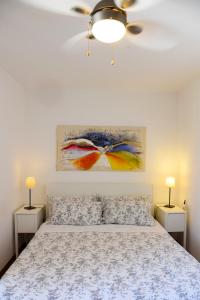 a bedroom with a bed and two night stands at Casa San Giorgio Varenna in Varenna