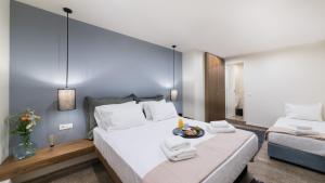 a hotel room with a bed and a desk at Ciel Living Athens in Athens