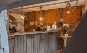 a large kitchen with a counter and a bar at Träumerei in Laubach