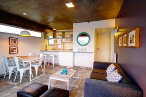 a living room with a table and a dining room at Depto 25 las Marías in San Salvador de Jujuy