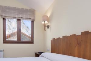 A bed or beds in a room at La Resplenda